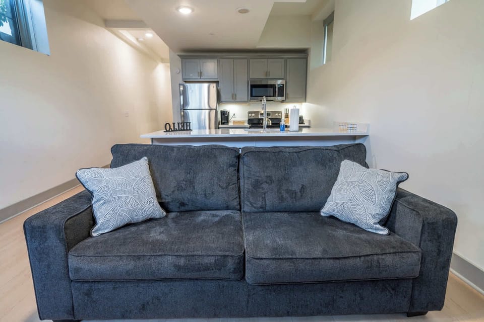 Living Room: Sink into a plush sofa after a day of exploring, with stylish decor and a welcoming ambiance.