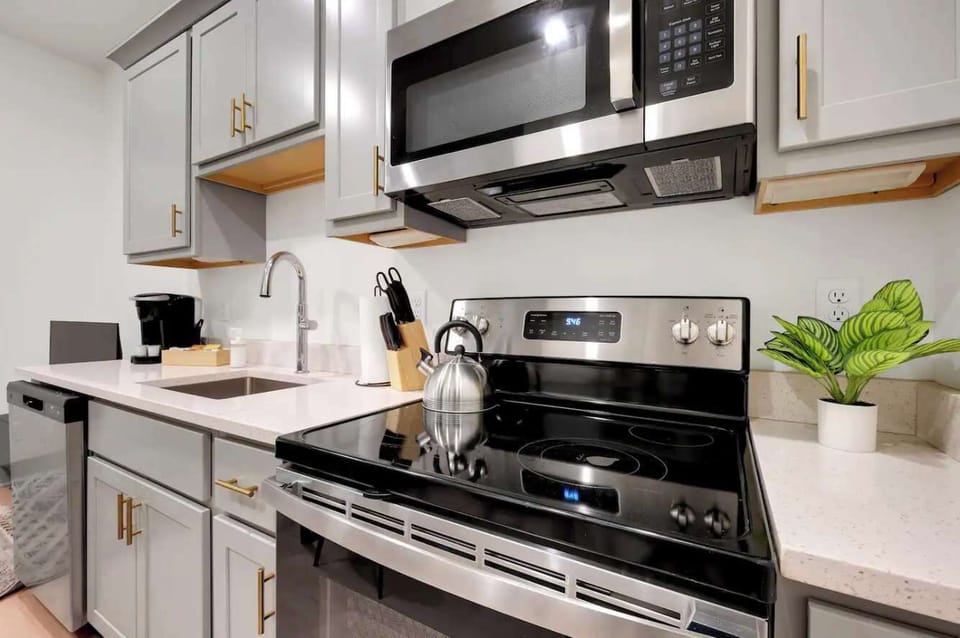 Kitchen: Modern kitchen with sleek stainless-steel appliances and ample counter space.