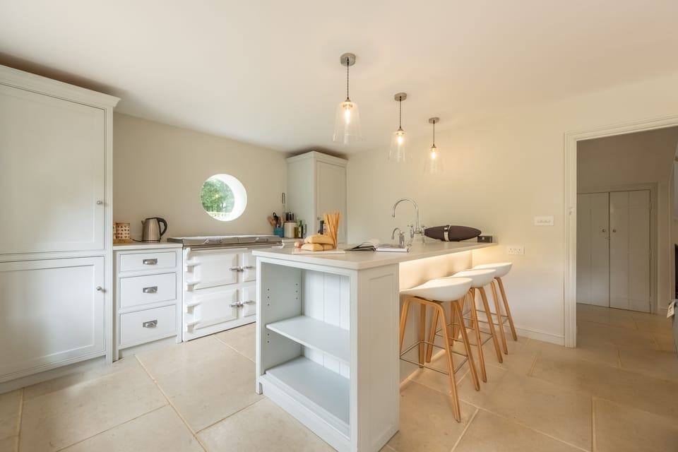 Ground floor: Modern kitchen with bar stools
