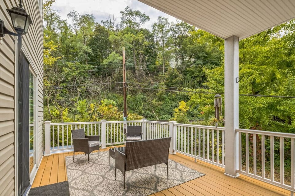 Private covered deck surrounded by trees