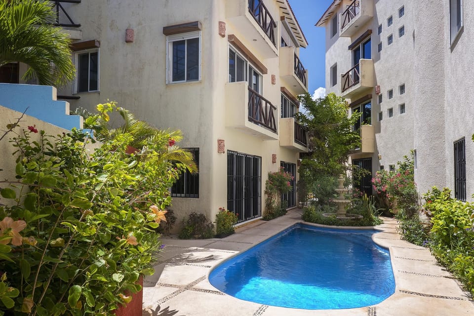 Secluded courtyard with refreshing pool and lush greenery