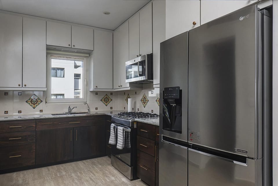 Modern kitchen with sleek appliances and ample storage