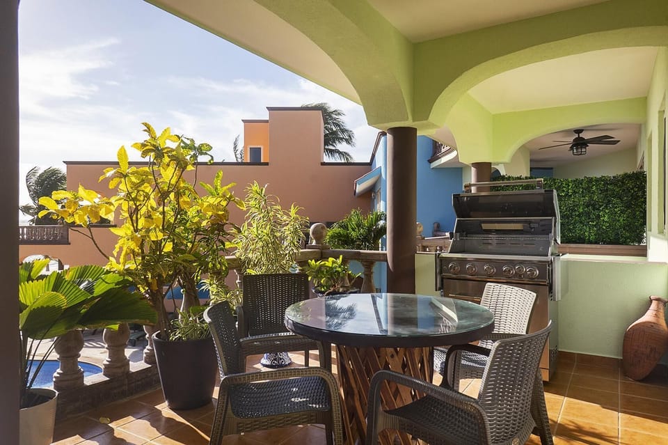 Cozy covered patio with dining and garden views for relaxing meals
