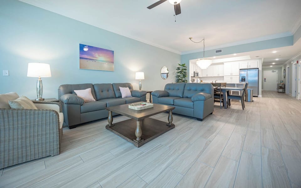 Relax on the cozy sofa with a queen sleeper in this inviting family room with coastal accents