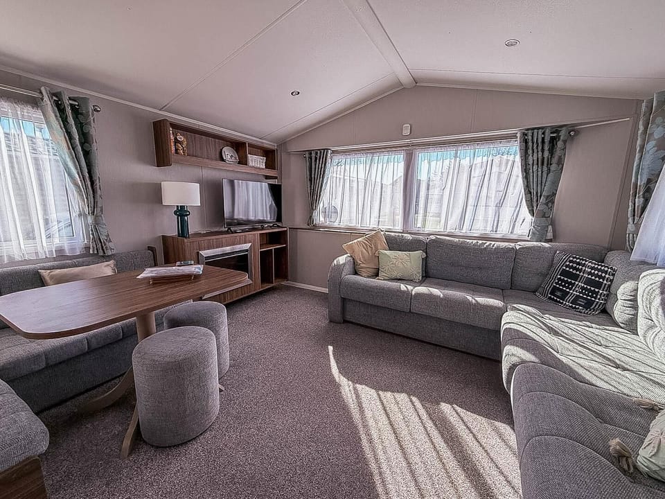 Hopton Holiday Village is a top choice for UK staycations, offering static caravan holidays with cosy living areas and easy access to the Norfolk coast and Great Yarmouth.