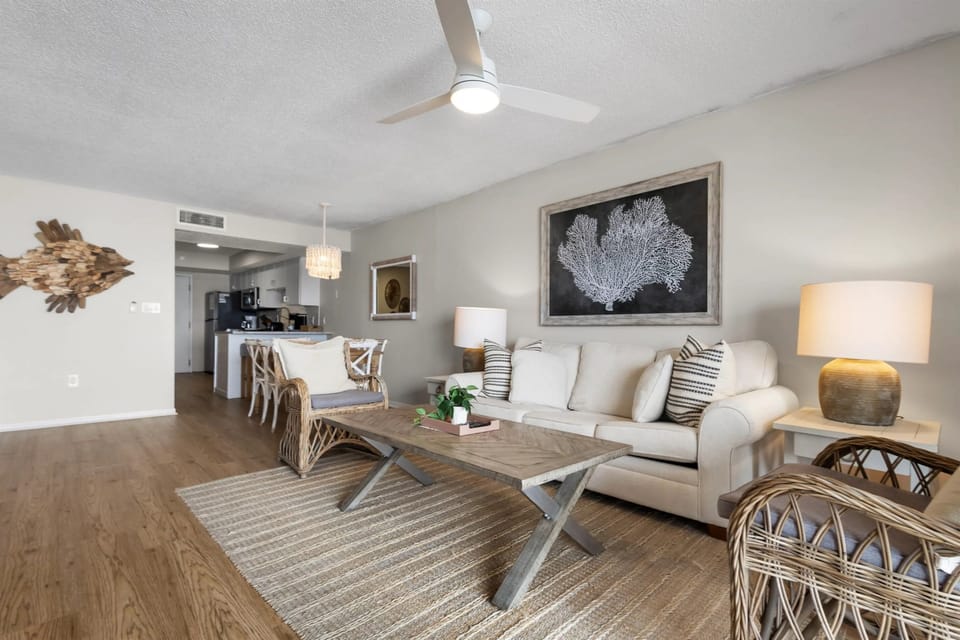 Living room featuring a comfortable sleeper sofa, stylish décor, and a welcoming atmosphere for relaxation and additional sleeping accommodations.