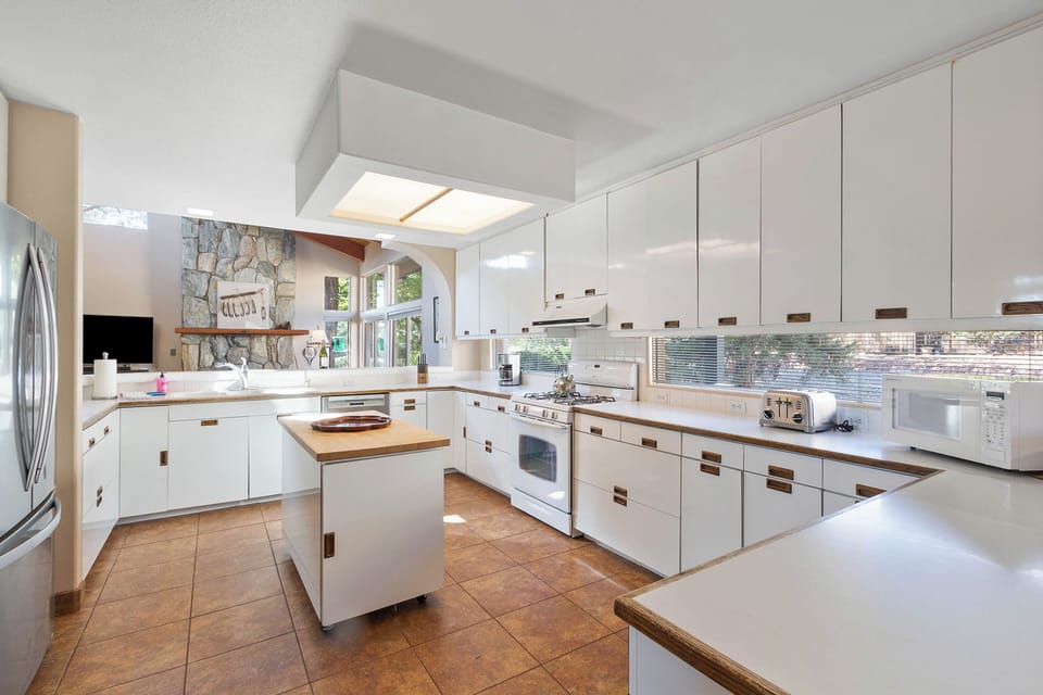 Kitchen is fully equipped kitchen boasts all necessary appliances and ample counter space