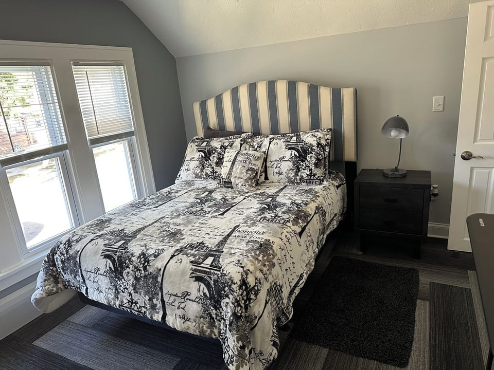 Bedroom #2 w/Full-size Tempur-Pedic bed. Wireless charging lamp and bay windows for sunlight.