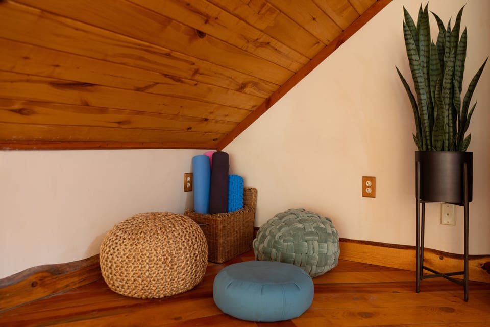 5 yoga mats are provided, as well as yoga blocks and a bolster.