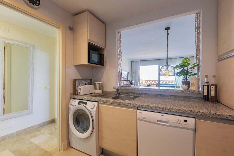 Open kitchen overlooking the living room and dinning area