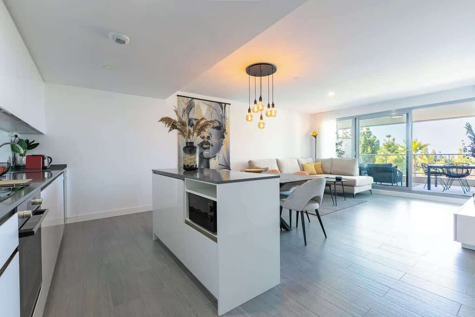 The open floor plan kitchen, dining table and living room