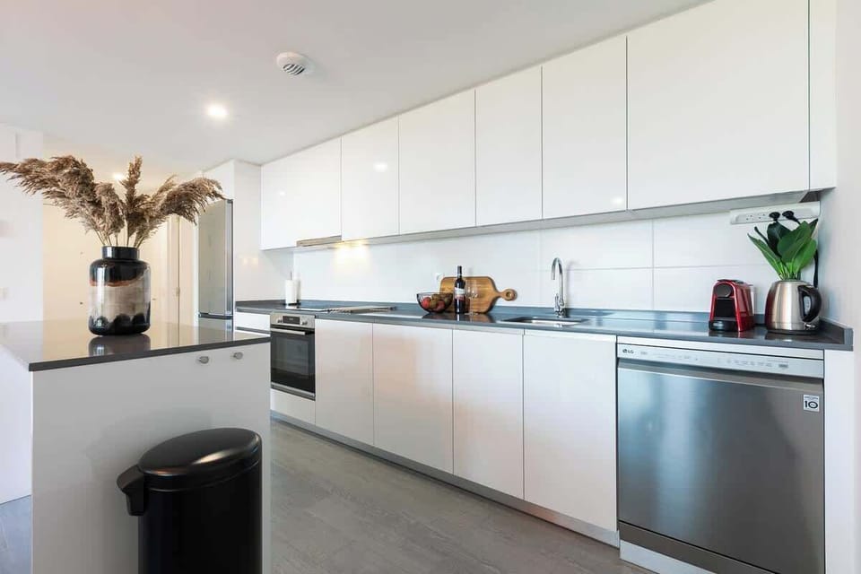 The open floor plan kitchen, dining table and living room