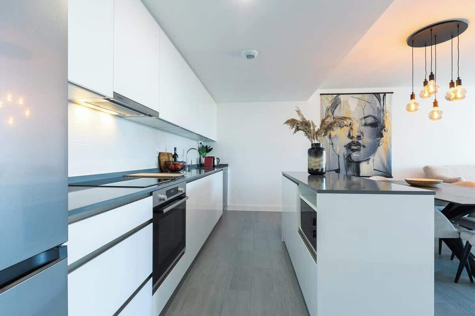 The open floor plan kitchen, dining table and living room
