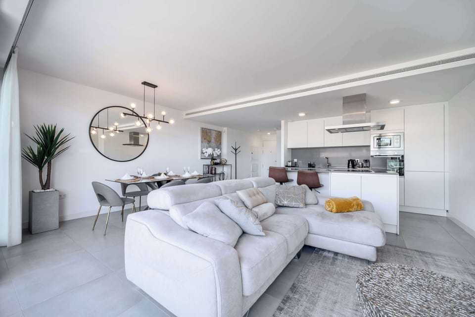 Bright living room with a comfortable sofa and a welcoming space to relax and enjoy your time indoors.