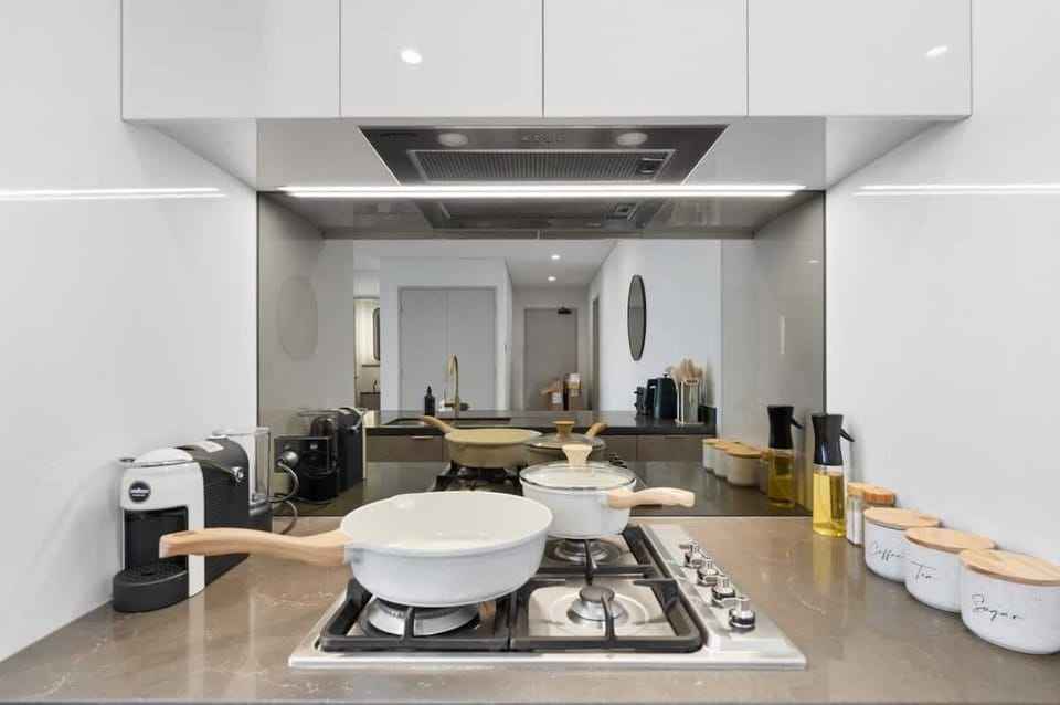 The kitchen is also equipped with cooking essentials including oil, salt, pepper, sugar, and a tea and coffee