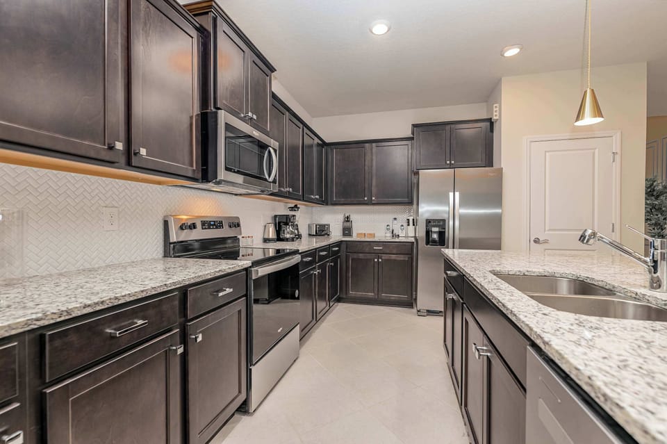 The spacious kitchen is fully-equipped with quality appliances.