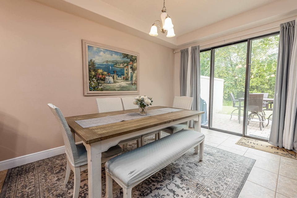 A beautiful wood dining table that can comfortably seat at least 6 for a relaxed meal at home.