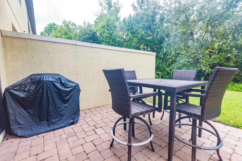 Enjoy meals outdoors on the private patio with a dining table.