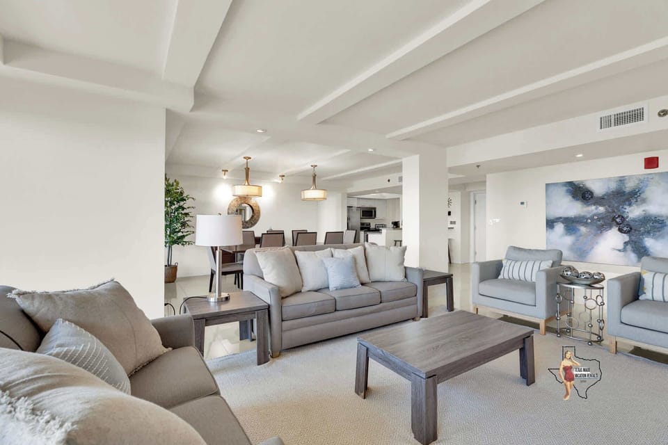 A spacious living room, featuring plush seating.