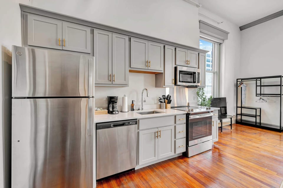 Kitchen: Modern kitchen with sleek stainless-steel appliances and ample counter space, plus a dining area good for four.