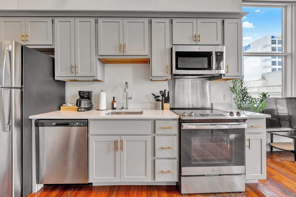 Kitchen: Modern kitchen with sleek stainless-steel appliances and ample counter space, plus a dining area good for four.