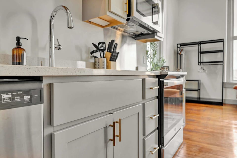 Kitchen: Modern kitchen with sleek stainless-steel appliances and ample counter space, plus a dining area good for four.