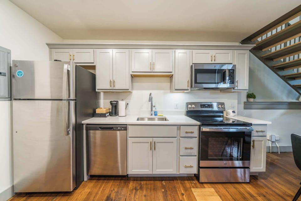 Kitchen: Bright and inviting kitchen and dining space, embraced with natural light.