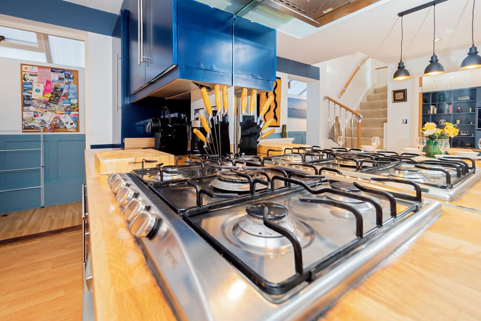 Kitchen: Cook up a storm in this modern space with sleek design and handy tools!