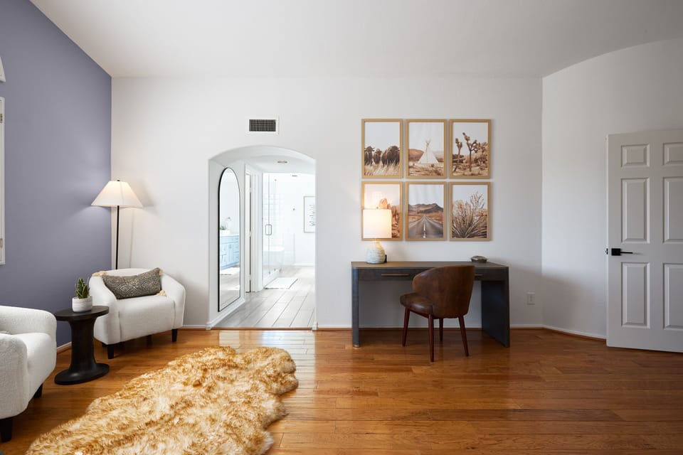 Primary bedroom has a King bed, smart TV, lounge area, office workspace area, and a large en-suite bathroom. (2nd Floor)