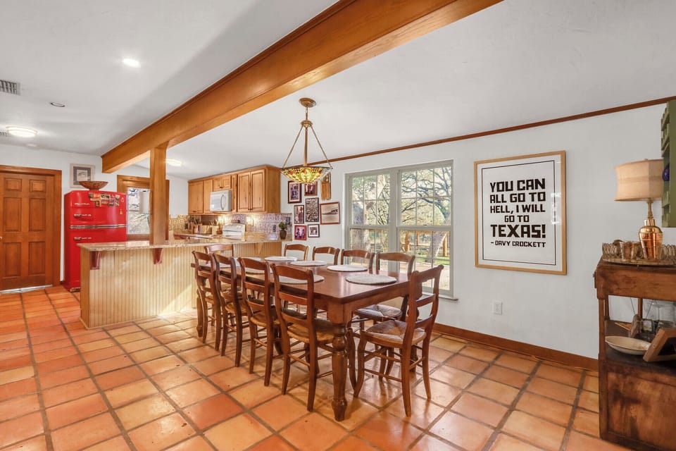 The kitchen is behind the dining room