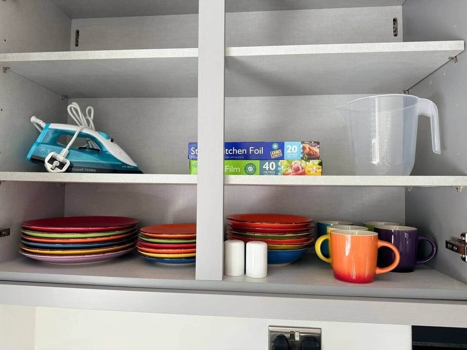 Crockery, iron, cling film, tin foil and cooking utensils supplied 