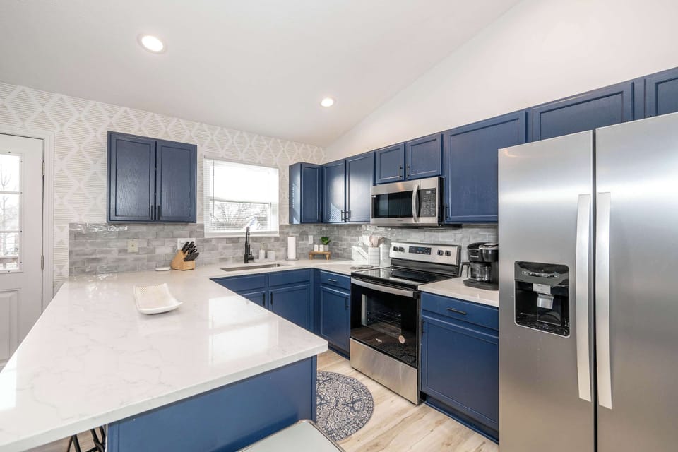 This serene kitchen offers ample space & all the comforts of home