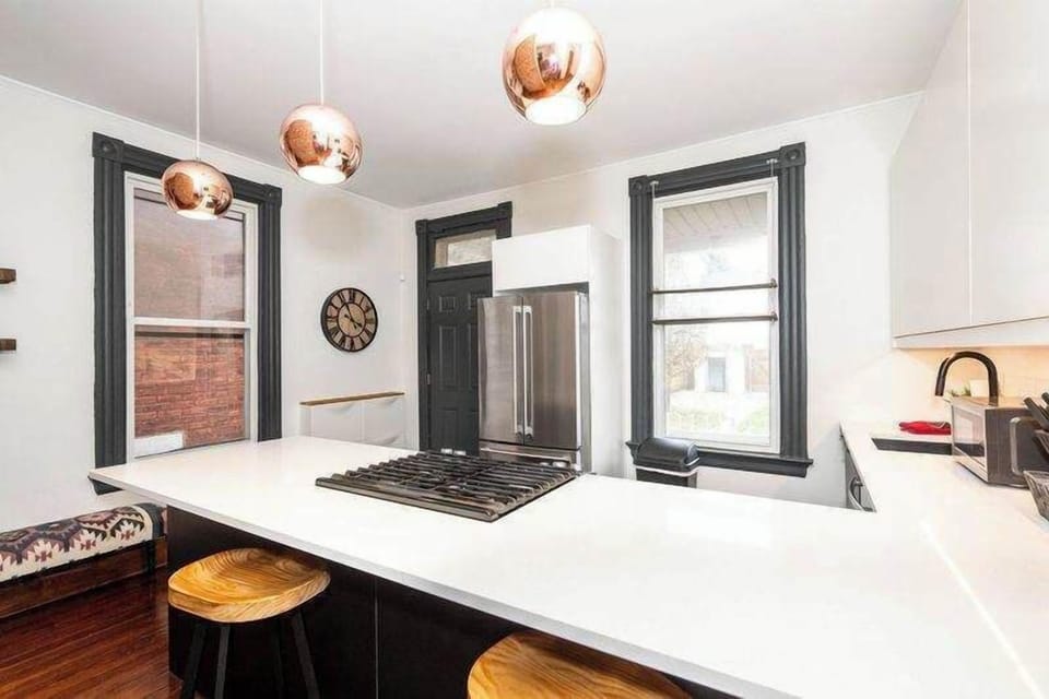 The sleek, open kitchen offers ample space & every home comfort