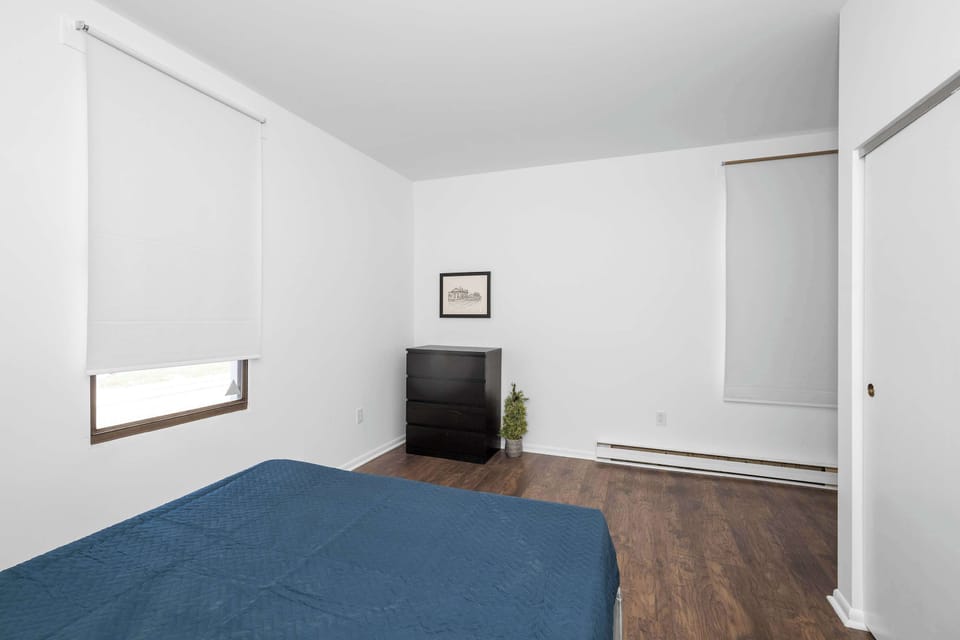 The peaceful bedroom retreat showcases an opulent queen-sized bed