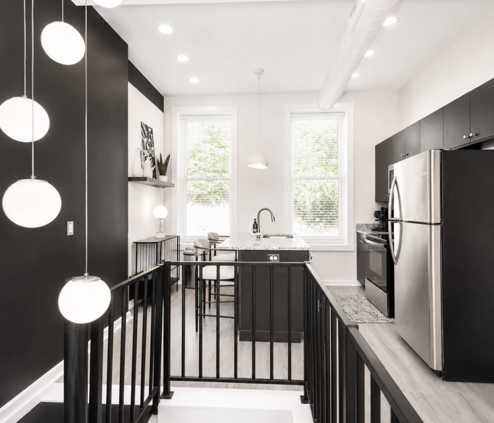 The chic, open kitchen offers loads of room & all the comforts of home