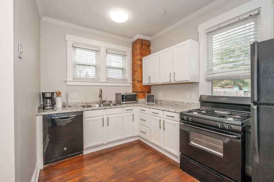 The chic eat-in kitchen offers ample space & all the comforts of home