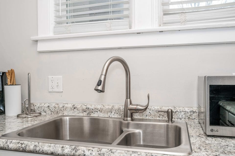 The chic eat-in kitchen offers ample space & all the comforts of home