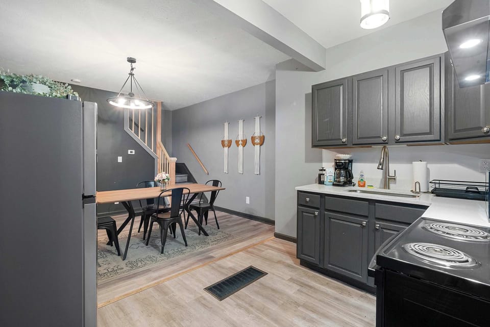 The chic, open kitchen offers ample space & every home comfort