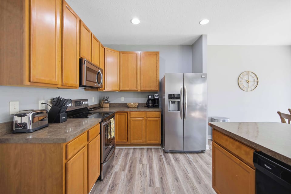 The open, airy kitchen offers ample space & every home comfort