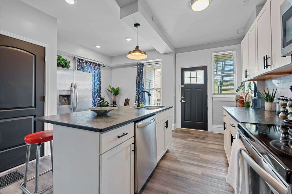 Apartment 1164’s open, airy kitchen offers ample space & every home comfort