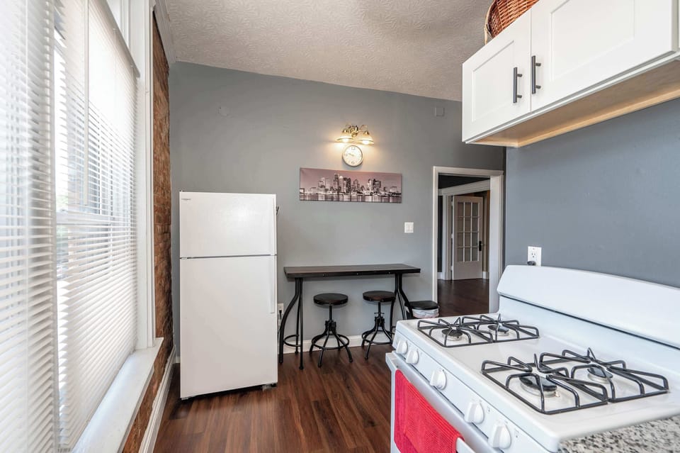 Enjoy the historic charm of the eat-in kitchen, offering dining seating for 2
