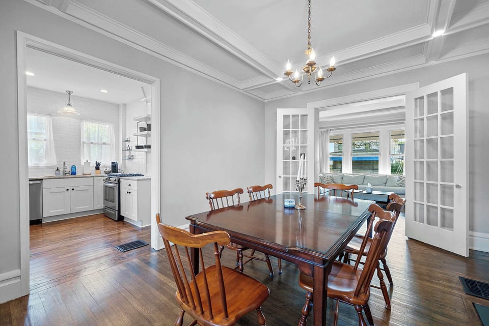 Gather for meals together in the chic dining room, offering seating for 6