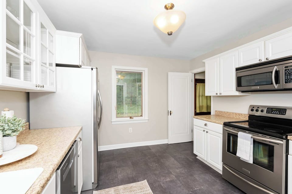 The updated kitchen is spacious & offers all the comforts of home