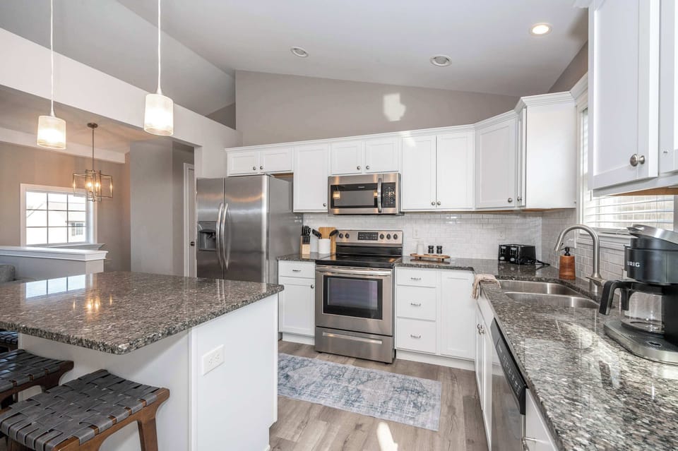 The open, airy kitchen offers loads of space & all the comforts of home