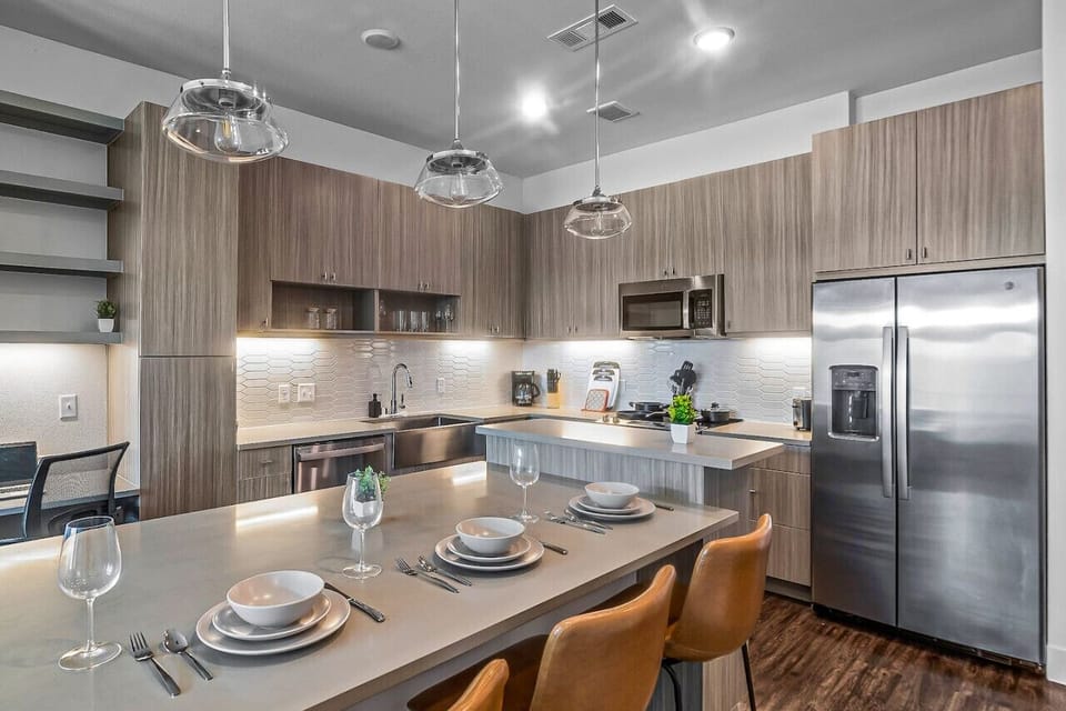 Set the table for memorable meals in this beautifully arranged dining area. With elegant place settings and a charming centerpiece, it's perfect for hosting dinner parties or enjoying family dinners in a cozy and stylish atmosphere.