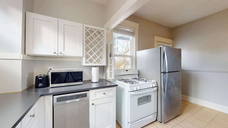 The bright, airy kitchen offers ample space & all the comforts of home