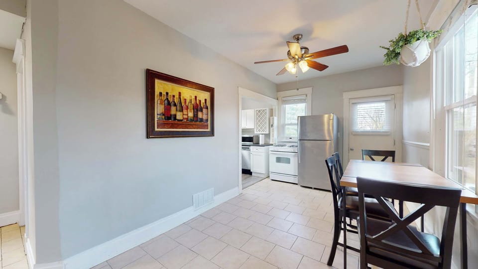 Gather for meals together at the dining table, offering seating for 4