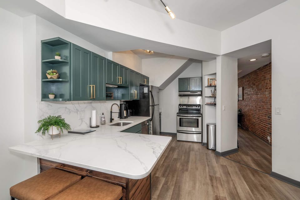 The elegant kitchen offers ample space & all the comforts of home