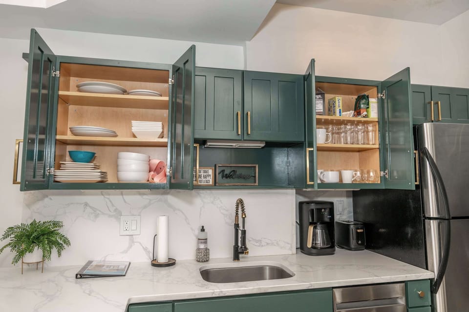 The elegant kitchen offers ample space & all the comforts of home