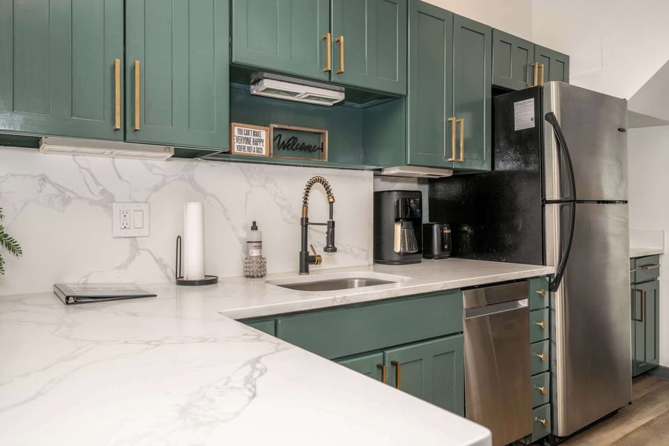 The elegant kitchen offers ample space & all the comforts of home